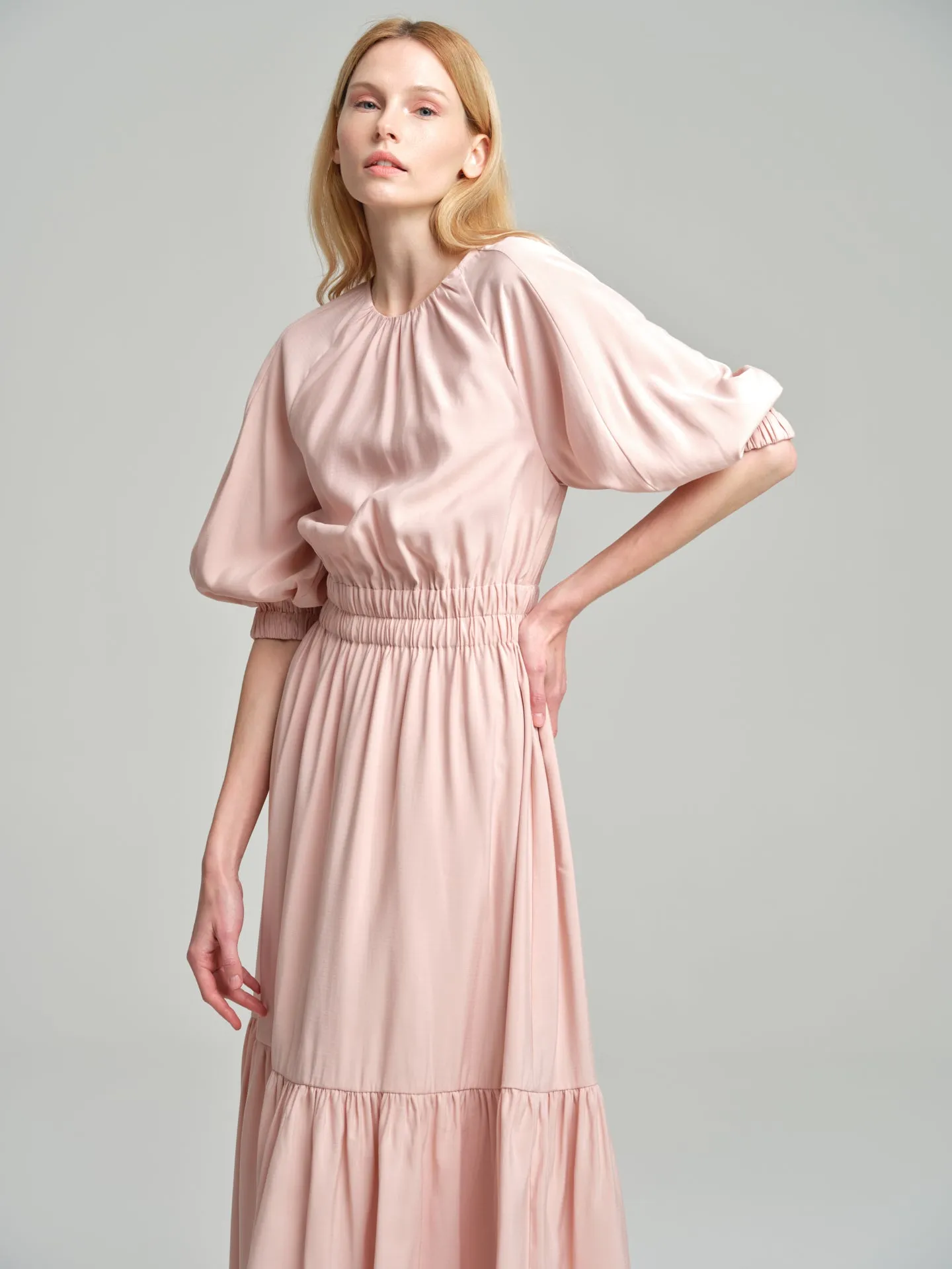 Volume dress with smocked waistline